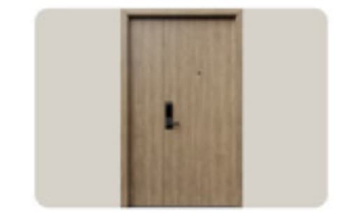 Cửa chính bàn giao tại Phòng khách / bếp — Cửa chống cháy (Woodsland / An Cường), căn hộ Peninsula Private Đà Nẵng